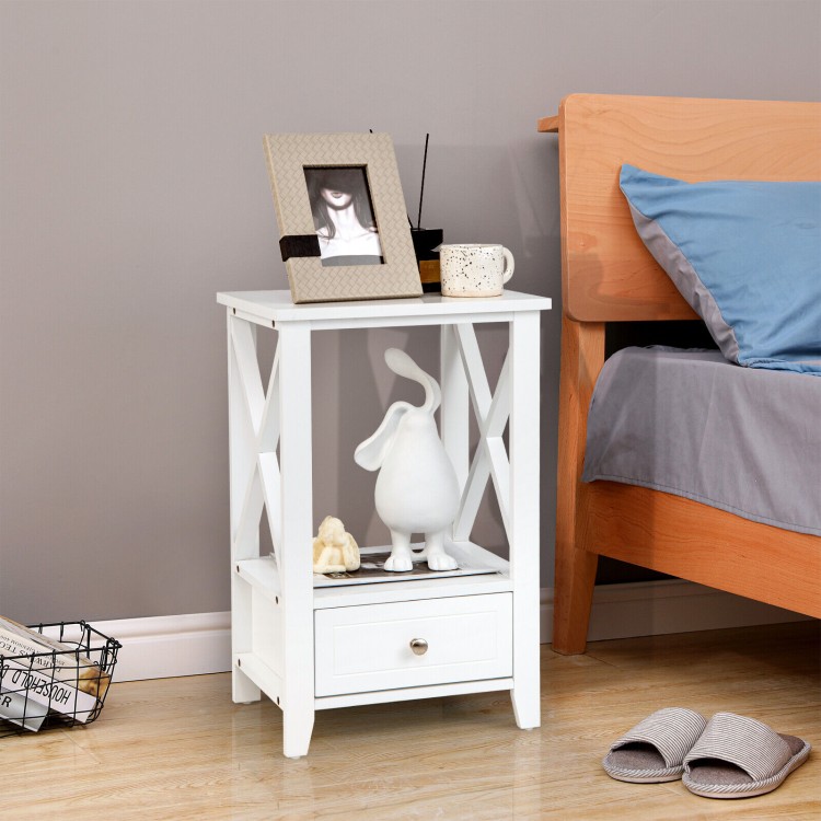 White 2-tier nightstand with storage drawer, open shelf, and X-shaped design for versatile use in any room.