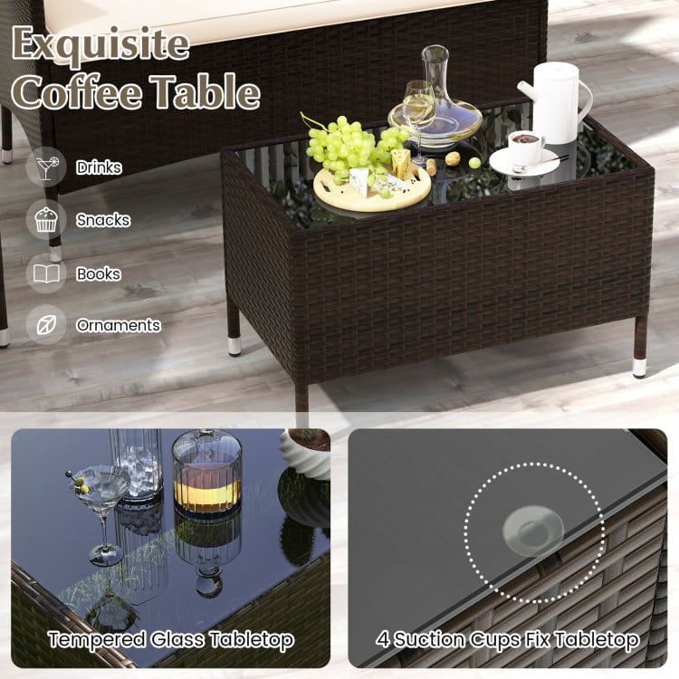 Coffee table with tempered glass top and rattan design, ideal for outdoor use in patio or garden settings.