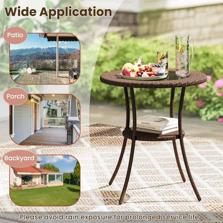 Round PE wicker patio bistro table with tempered glass top and shelf, ideal for outdoor use on patio or porch.