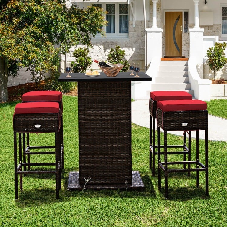 5-piece patio rattan bar set with red cushioned stools and hidden storage, perfect for outdoor leisure by the poolside.