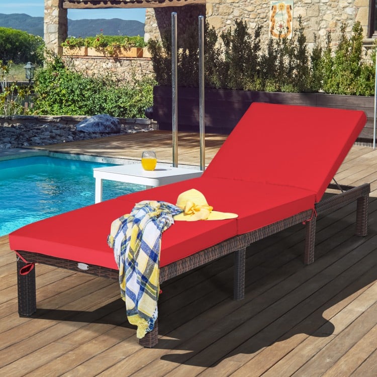 Red outdoor rattan adjustable chaise lounge with cushioned seat, perfect for poolside relaxation and comfort.