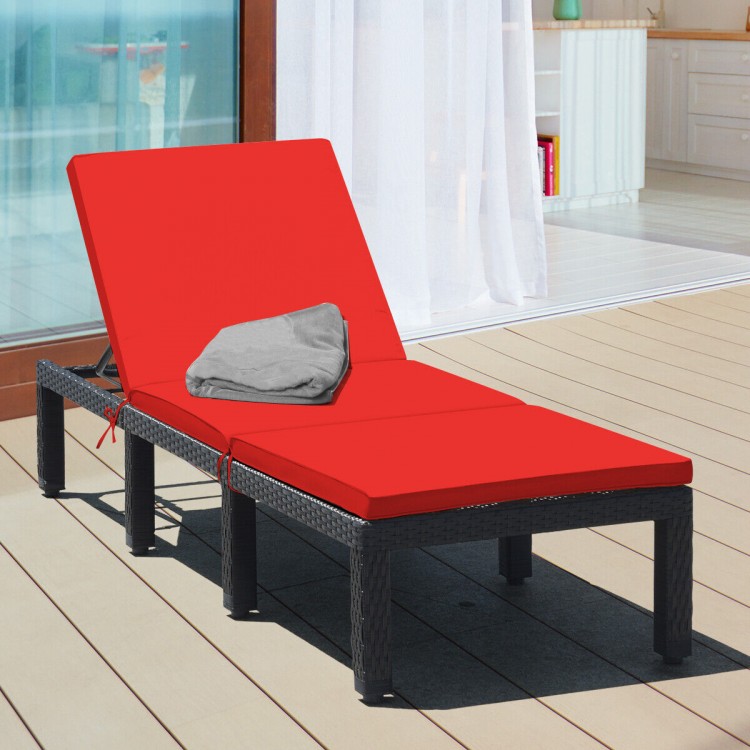 Height adjustable patio rattan lounge chair with red cushion, perfect for outdoor relaxation by the poolside or garden.