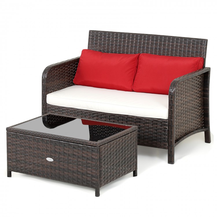 Wicker loveseat set with red cushions and coffee table, featuring brown PE rattan for outdoor use and a glass top.