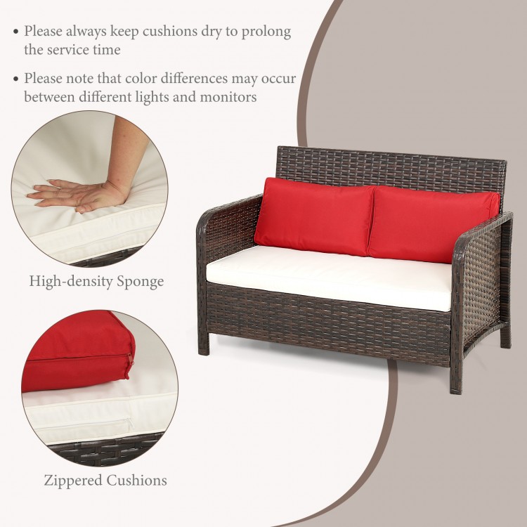 Wicker loveseat set with red zippered cushions and ergonomic backrest, perfect for outdoor relaxation by the poolside.