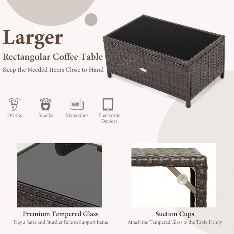 Rectangular coffee table with black tempered glass top and hand-woven brown PE rattan, ideal for outdoor use.