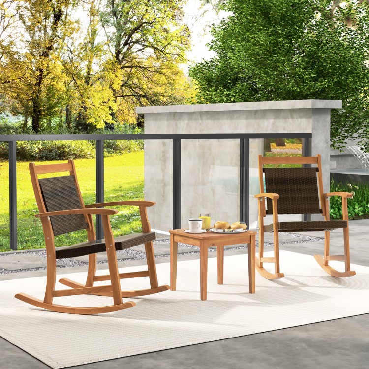 Acacia wood patio rocking chair set with side table, featuring weather-resistant wicker for outdoor relaxation.