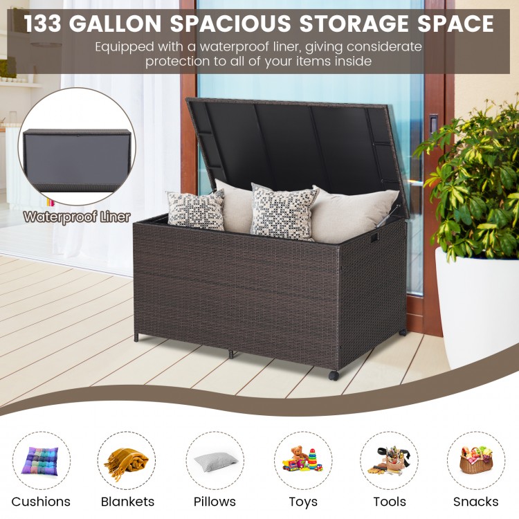 Outdoor wicker storage box with waterproof liner, 133-gallon capacity, ideal for patio or poolside use.