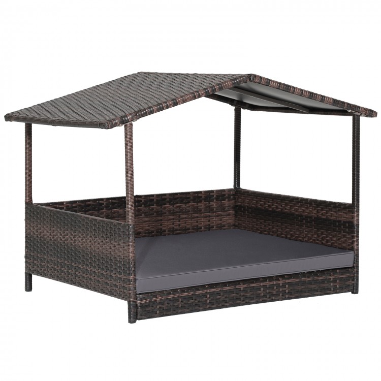 Wicker dog house with weatherproof roof and soft cushion, perfect for outdoor use in any weather.