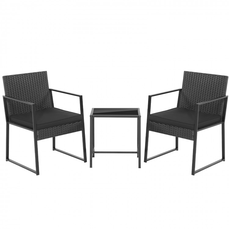 Two black armchairs with soft cushions and a glass-top coffee table, perfect for small outdoor spaces.