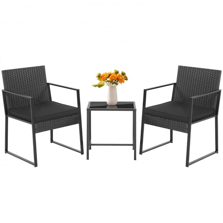 Two black patio chairs with soft cushions and a glass-top coffee table, perfect for porches and balconies.