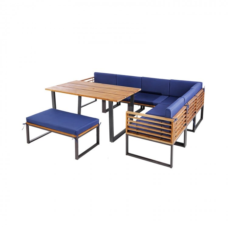 L-shaped patio dining set featuring acacia wood, navy cushions, and a 2-in-1 ottoman for outdoor relaxation.