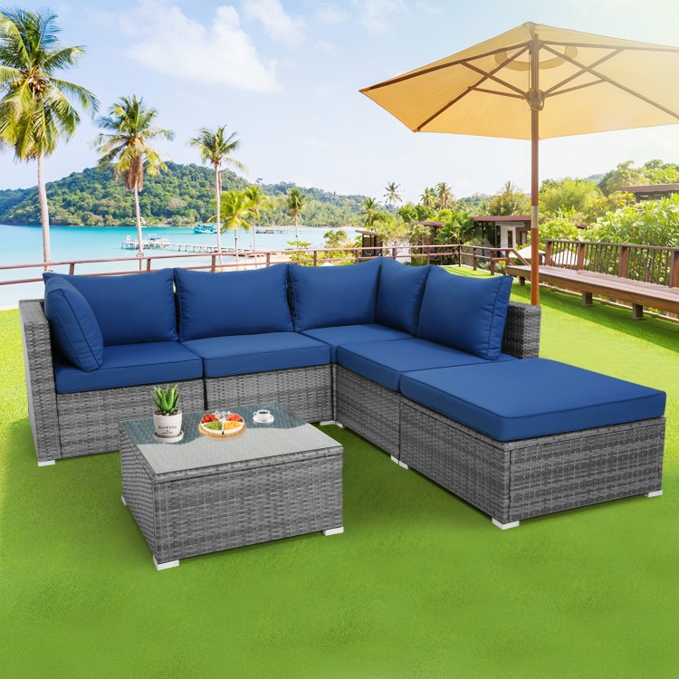 L-shaped 6-piece outdoor rattan sofa set with navy cushions, perfect for patio and garden relaxation.