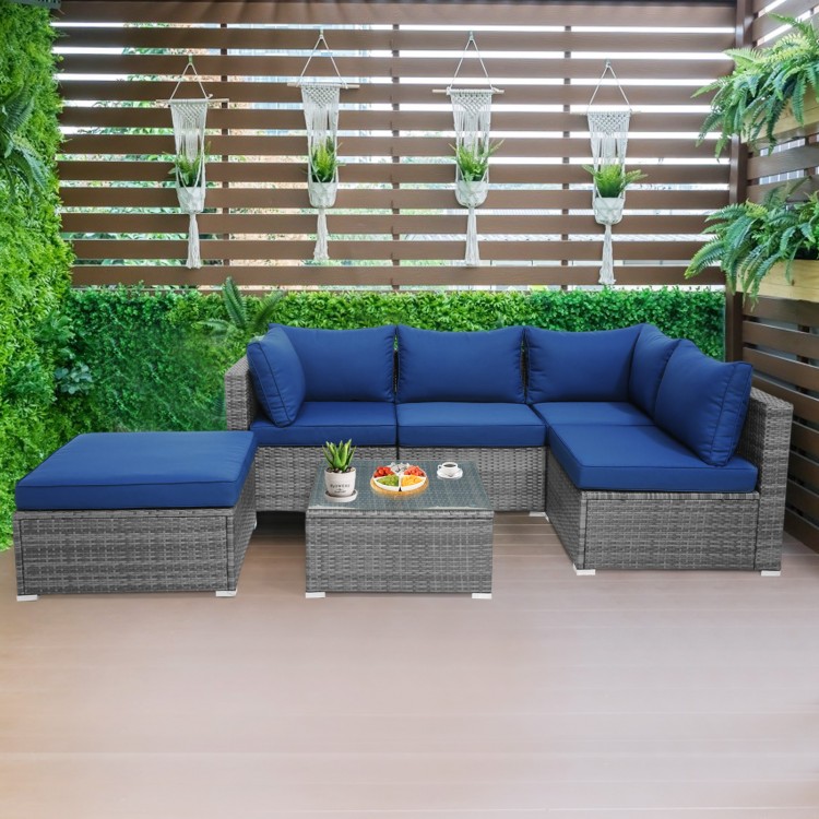 L-shaped outdoor rattan sofa set with navy cushions and coffee table, perfect for patio or garden relaxation.