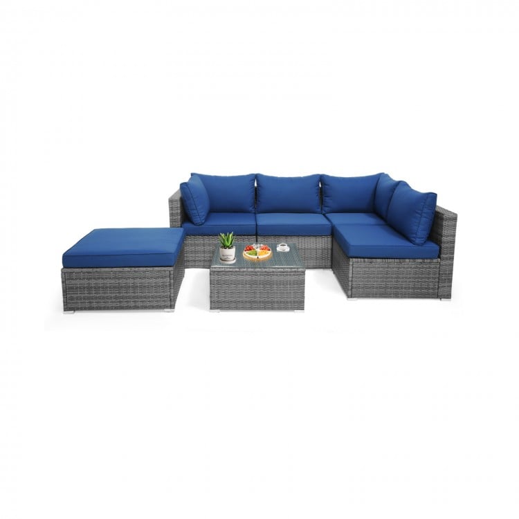 L-shaped 6-piece outdoor rattan sofa set with navy cushions, perfect for patio or garden relaxation.