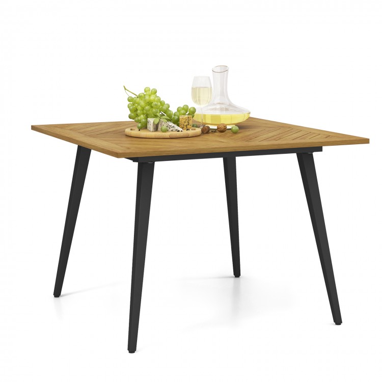 Acacia wood outdoor dining table with black metal legs, perfect for 4 people, ideal for garden or poolside use.