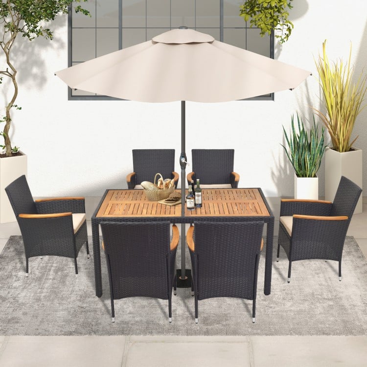 Top view of the 7-piece outdoor dining set showcasing the slatted acacia wood table and padded chairs, perfect for.