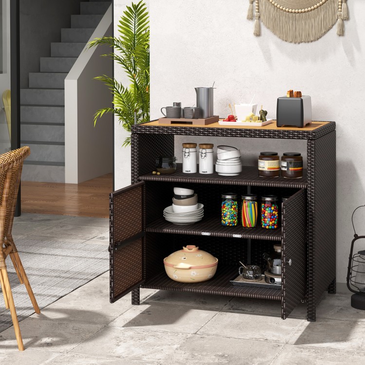 Rattan storage cabinet with acacia wood countertop, featuring two doors for outdoor patio and poolside organization.