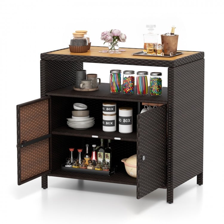 Rattan storage cabinet with acacia wood countertop, featuring two doors and shelves for outdoor patio organization.
