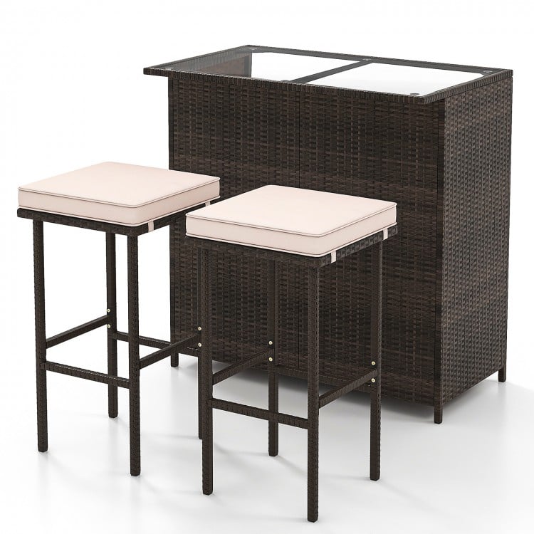 Patio bar set with tempered glass tabletop, featuring two stools with cushions for indoor and outdoor use.