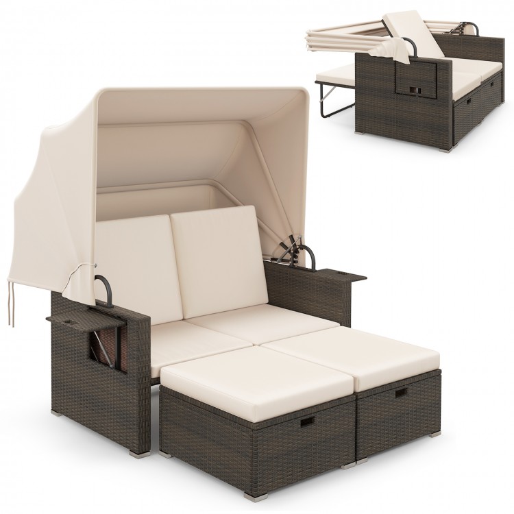 Outdoor patio rattan daybed with retractable canopy and adjustable backrests, perfect for backyard relaxation.