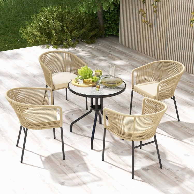 Set of 4 yellow patio chairs with curved backrests and cushions, ideal for outdoor relaxation and support.