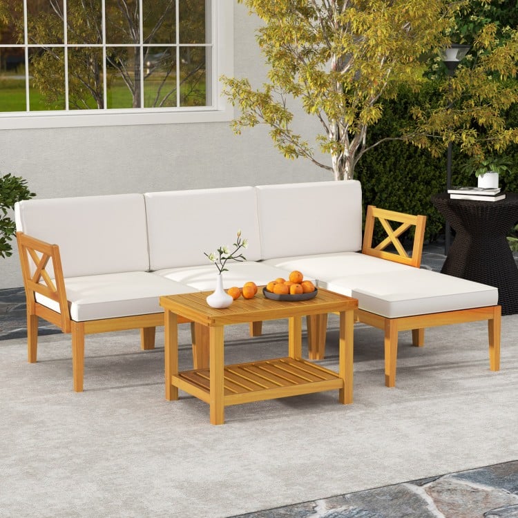 L-shaped acacia wood patio sofa with white cushions, perfect for versatile outdoor arrangements in gardens or backyards.