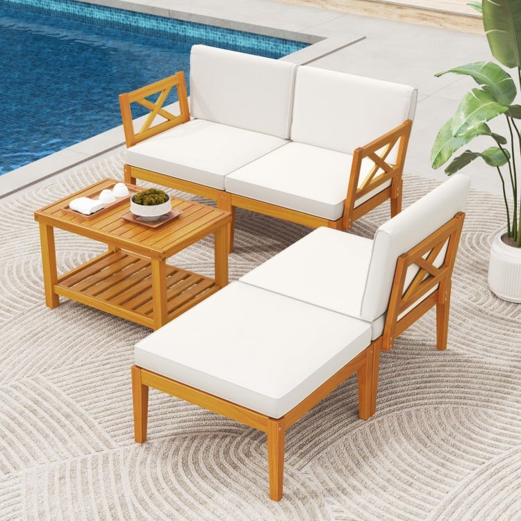 Acacia wood patio furniture set featuring white cushions and a 2-tier coffee table, ideal for outdoor relaxation by the.