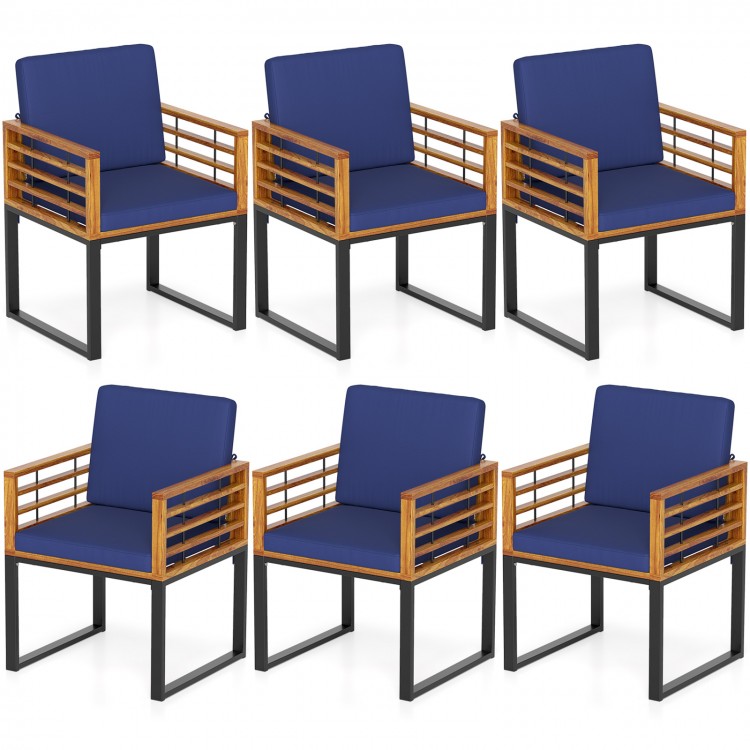 Set of 6 outdoor acacia wood patio dining chairs with navy seat back cushions, perfect for poolside or backyard use.