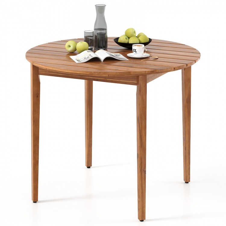 Round 36-inch acacia wood outdoor dining table for 4, featuring slatted design and adjustable foot pads for stability.