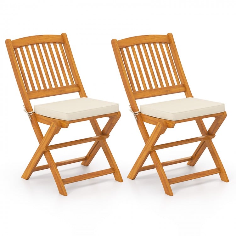 Set of 2 outdoor folding chairs made of acacia wood with beige seat cushions, ideal for picnics and dining.