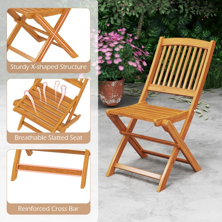 Outdoor folding chair made of acacia wood with breathable slatted seat and sturdy X-shaped structure, ideal for dining.