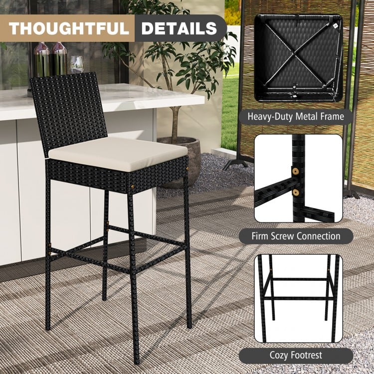 Black patio wicker barstool with backrest and footrest, featuring a durable metal frame and cozy cushion for outdoor.