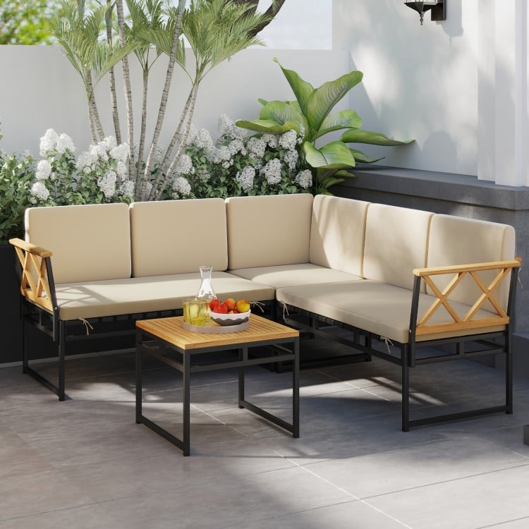 Corner view of the 4 Pieces Patio L-Shaped Sofa Set featuring beige cushions, sturdy frame, and elegant acacia wood.