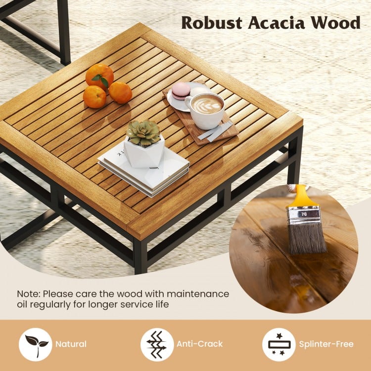 Close-up of the acacia wood tabletop with a coffee cup and decorative items, ideal for outdoor patio use.