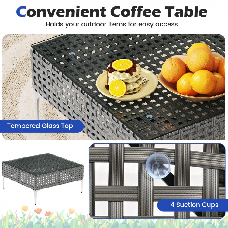 Tempered glass coffee table with PE rattan design and suction cups, perfect for outdoor patio or garden use.