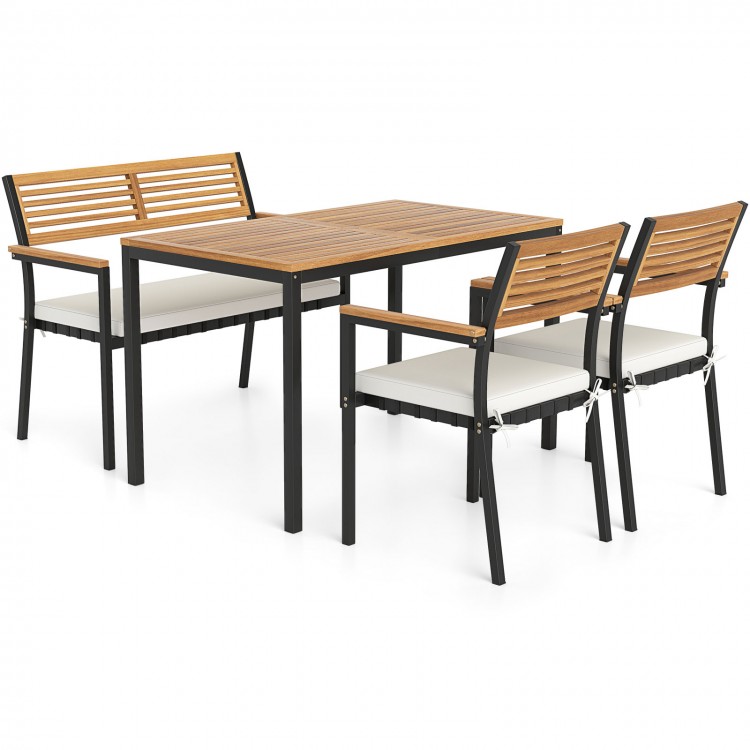 4-piece patio furniture set featuring acacia wood dining table and stackable chairs with white cushions for outdoor.
