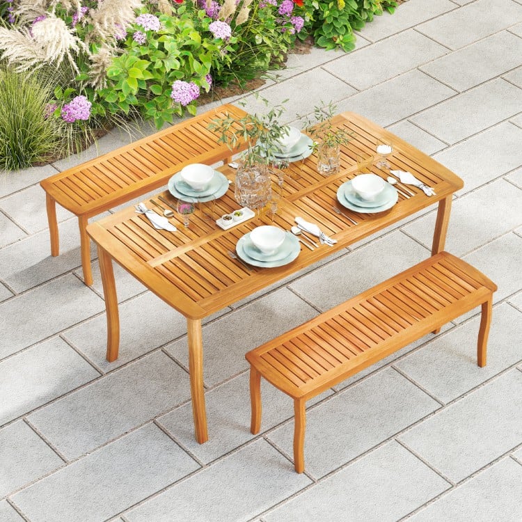 Outdoor dining table with acacia wood slatted top, seating for 4, and umbrella hole, perfect for patio gatherings.
