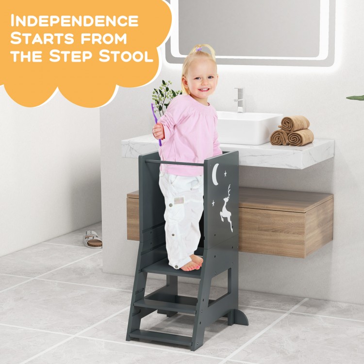 Toddler kitchen stool helper in gray with safety rail, adjustable footstep, ideal for bathroom or kitchen use.