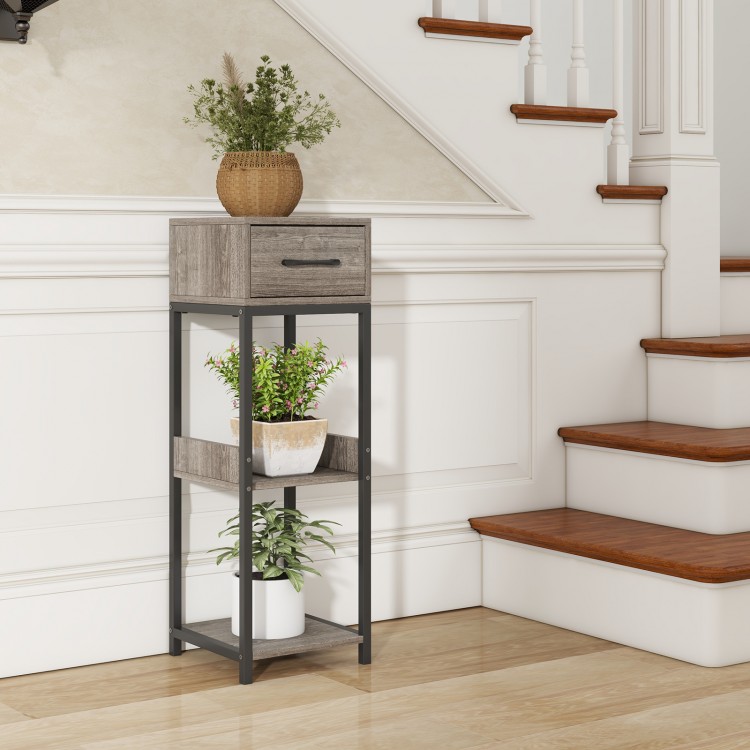 Gray 3-tier tall plant stand with drawer, showcasing raised baffle design and powder-coated metal for stability and.