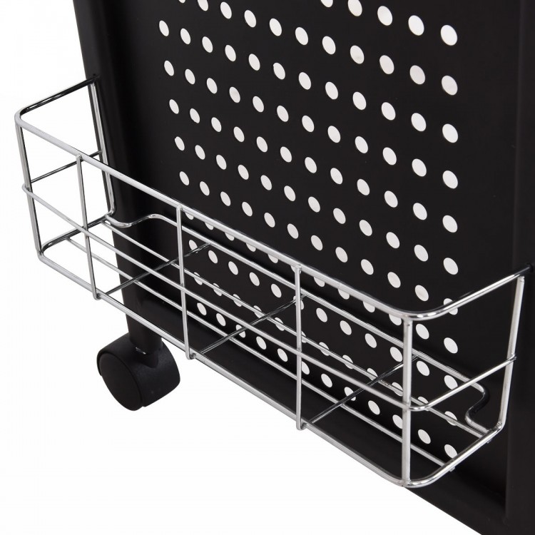 Storage basket attached to the Deluxe Salon Steel Frame Manicure Table, featuring a sturdy black design for salon.
