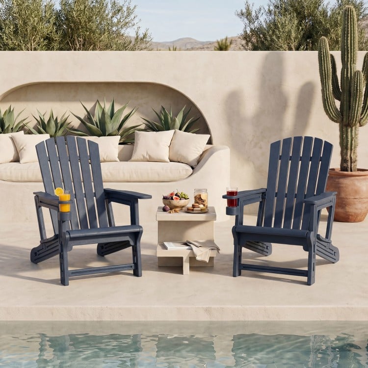 Two blue HDPE Adirondack chairs with cup holders and wood-like texture, perfect for relaxing by the poolside.