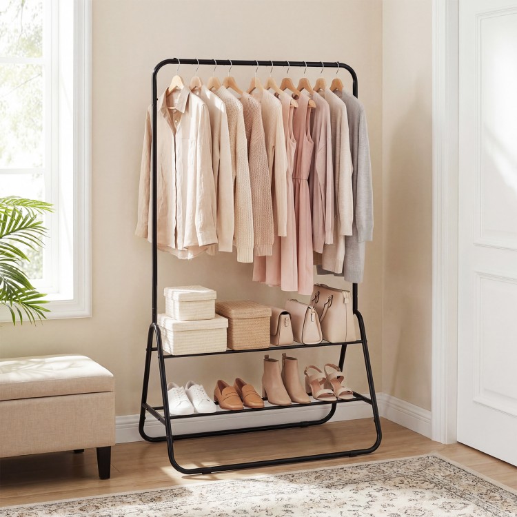 Heavy duty black clothes rack with hanging rod and two storage shelves, ideal for organizing dresses and shoes.
