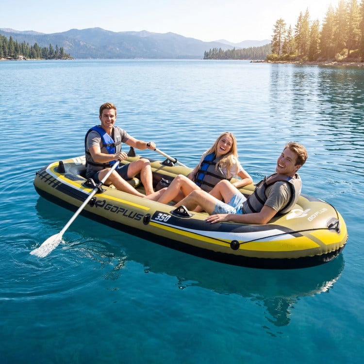 Three people enjoying the Heavy-Duty Inflatable Boat in a serene lake, perfect for fishing trips and family outings.