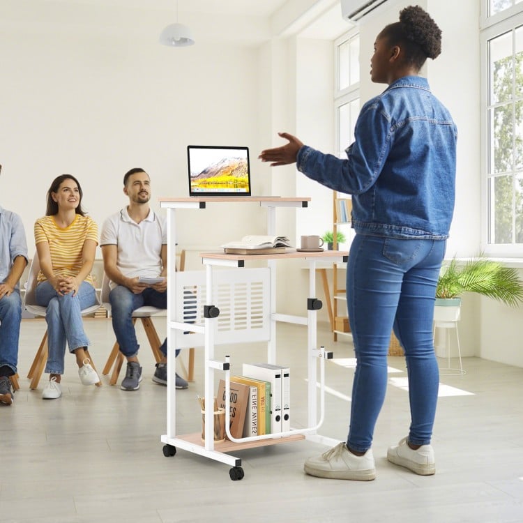 Height adjustable mobile computer stand-up desk with wheels, perfect for presentations and small spaces, shown in use.