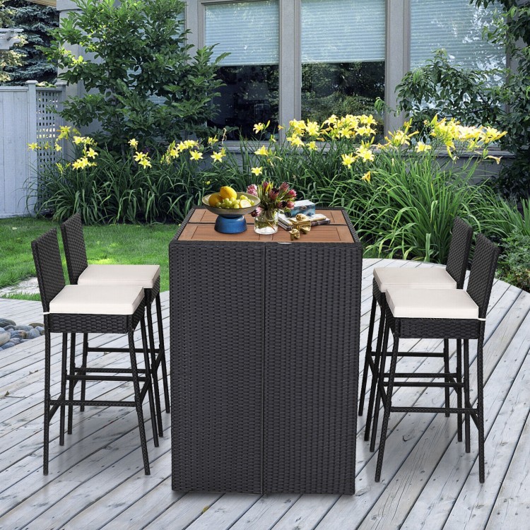 5-piece patio dining set featuring acacia wood table and PE wicker bar stools with soft cushions for outdoor comfort.