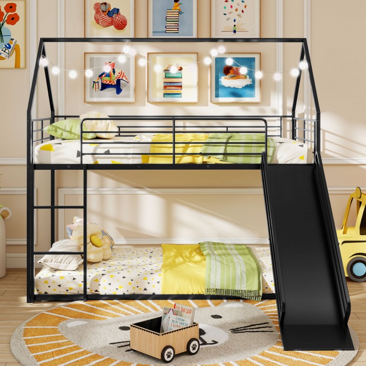 House-shaped black metal twin over twin low bunk bed with slide, safety guardrails, and playful design for kids' rooms.