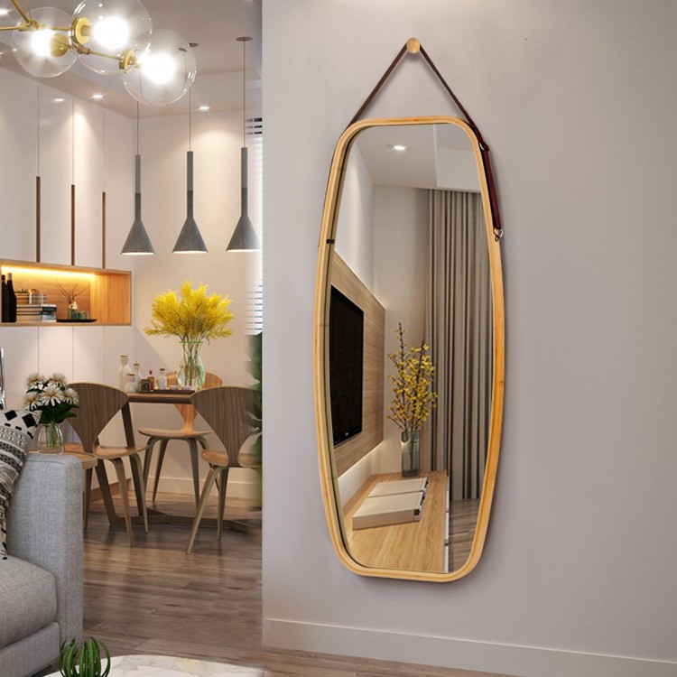 Stylish wall-mounted mirror with bamboo frame and adjustable leather strap, featuring rounded corners for elegant decor.