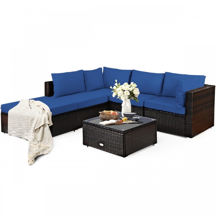 L-shaped outdoor patio rattan sofa set with blue cushions, coffee table, and ottoman, perfect for garden relaxation.