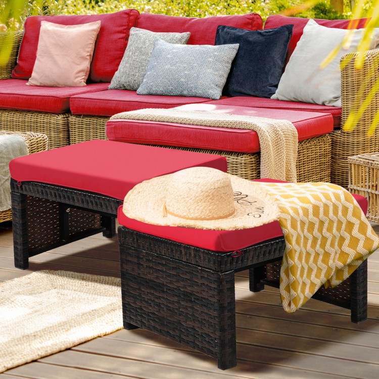 Red cushion patio rattan ottomans with X-frame design, suitable for outdoor use in garden or poolside settings.