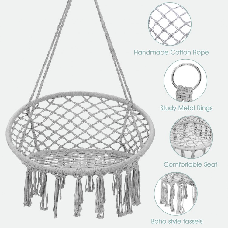 Hanging macrame hammock chair in gray with cotton backrest, sturdy metal rings, and boho tassels for indoor or outdoor.